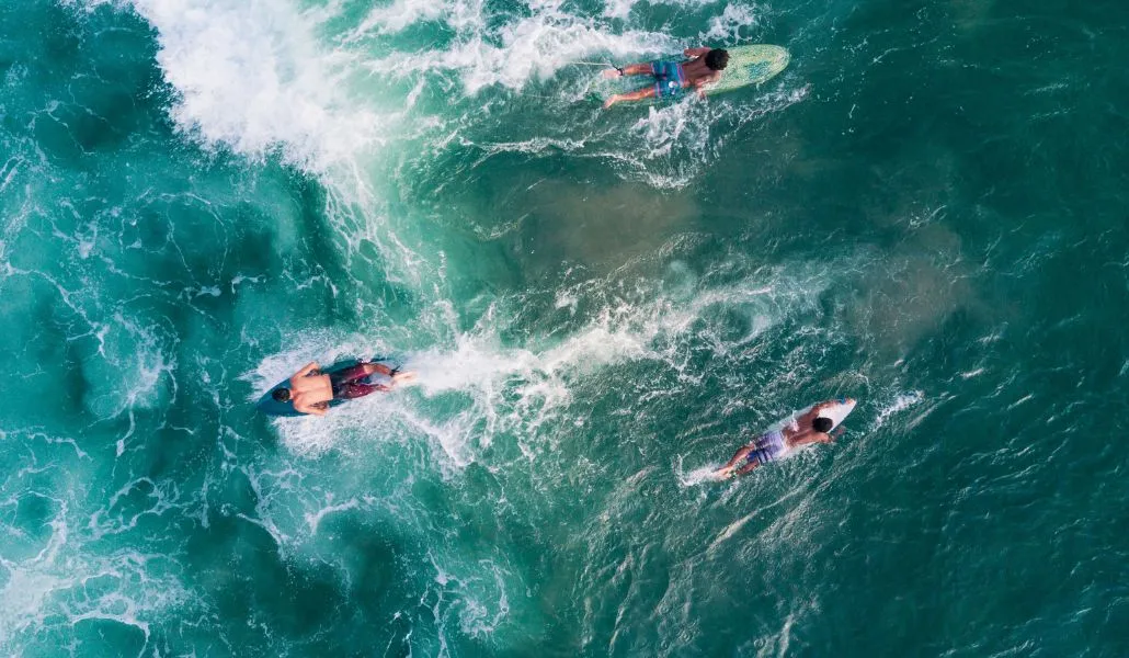 Surfers enjoying clean waves on Bali's east coast in Sanur
