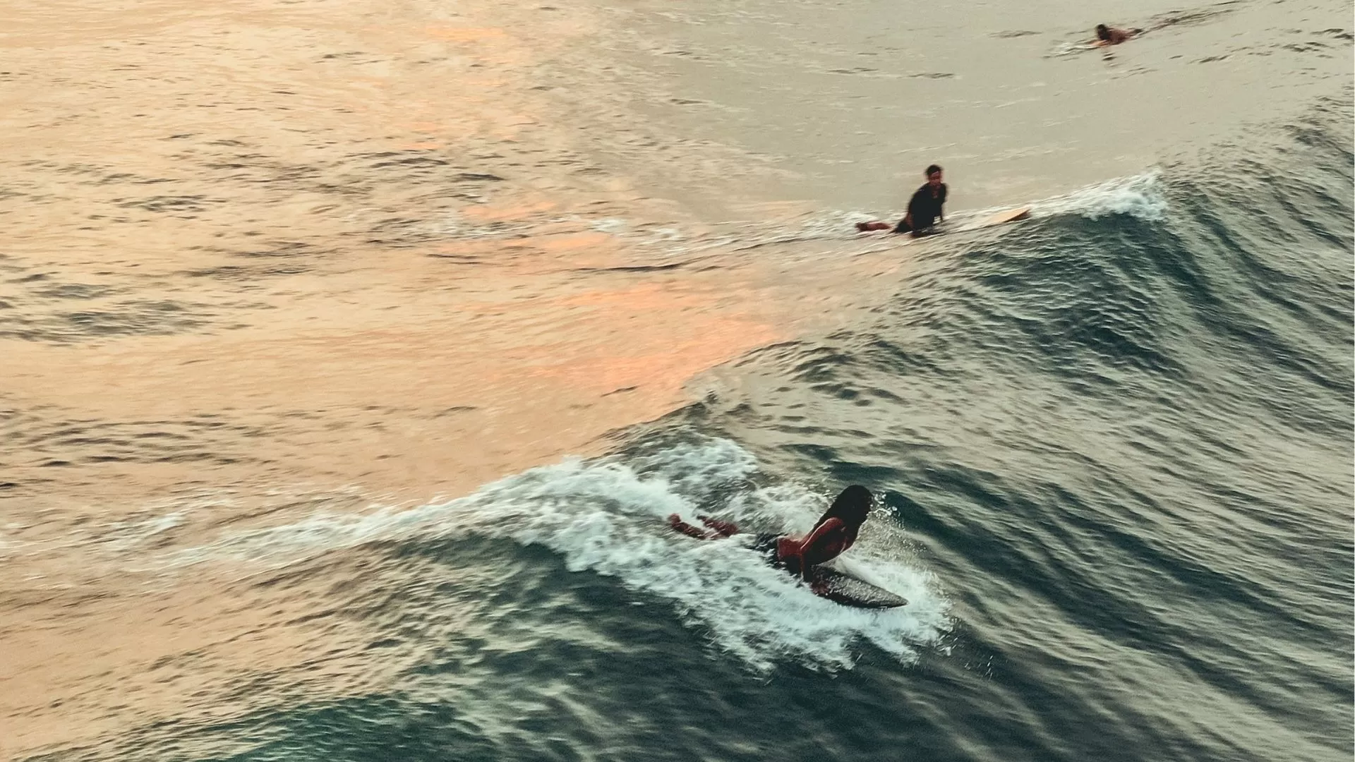 Surfer catching waves at Echo Beach Canggu