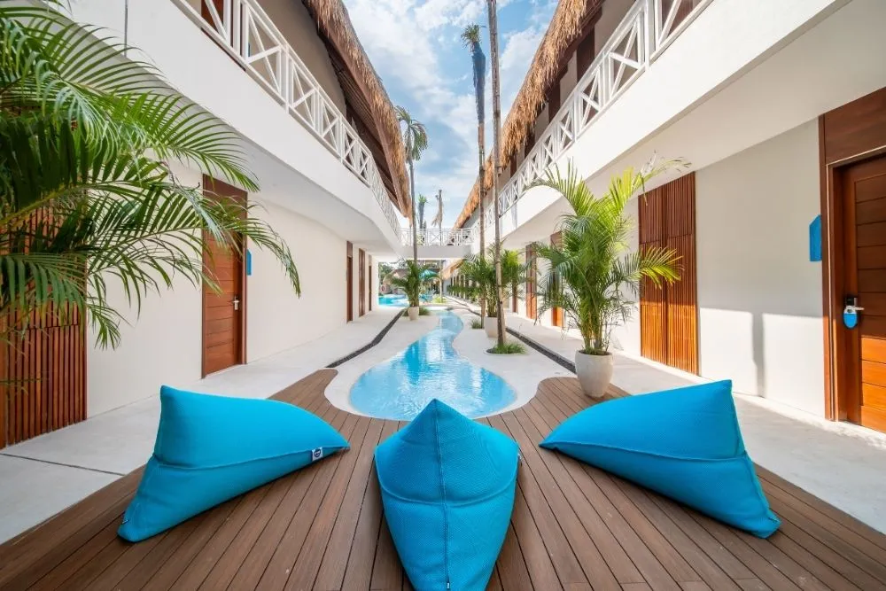 Stylish poolside area at IZE Canggu Bali – a modern family-friendly hotel offering a relaxed beach lifestyle for active travelers